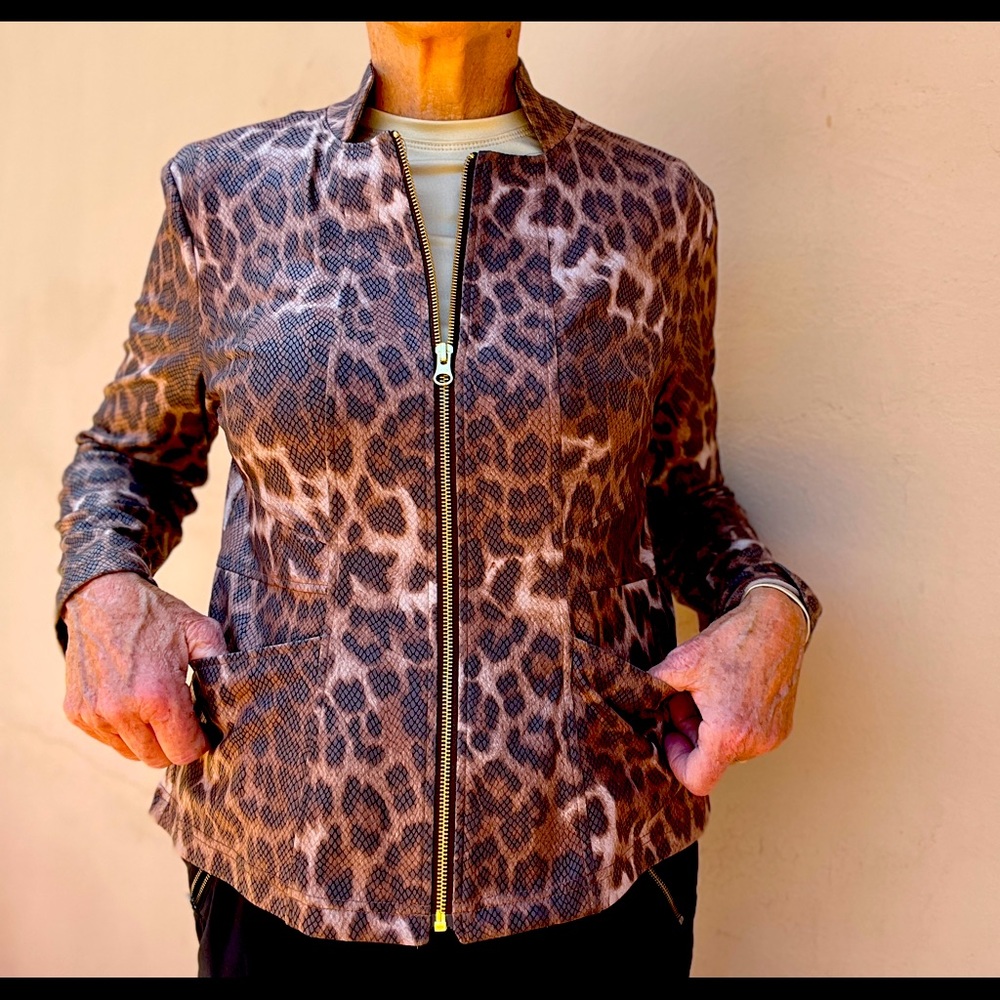Faux leather. Zip front. 95% poly 5% spandex. Hand wash. Fits 8-10.